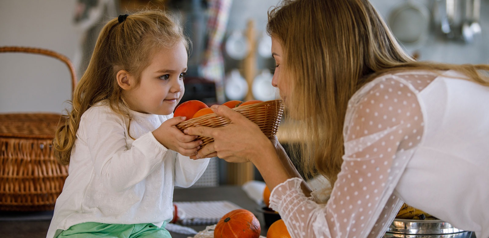 Mother and daughter preparing food kitchen