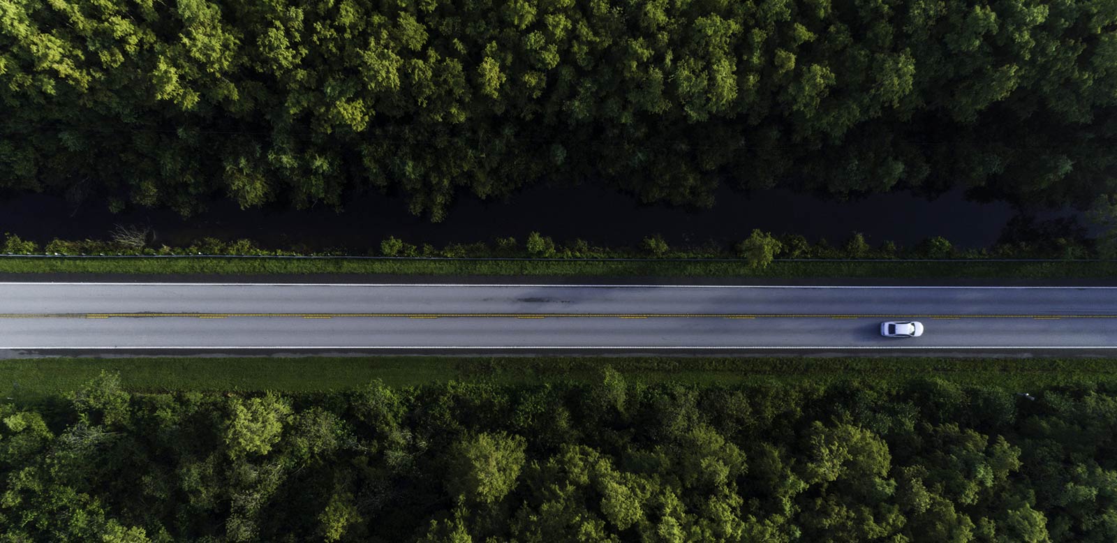 Overhead shot of car driving down road